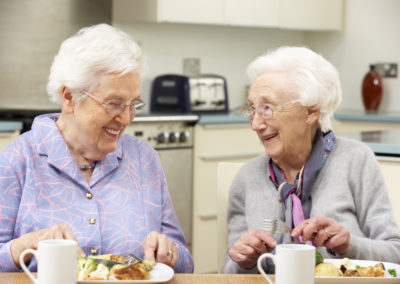Senior women enjoying meal together